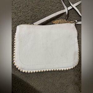 Ivory/Cream Jessica Simpson  bag 
-used, damage shown in the photo